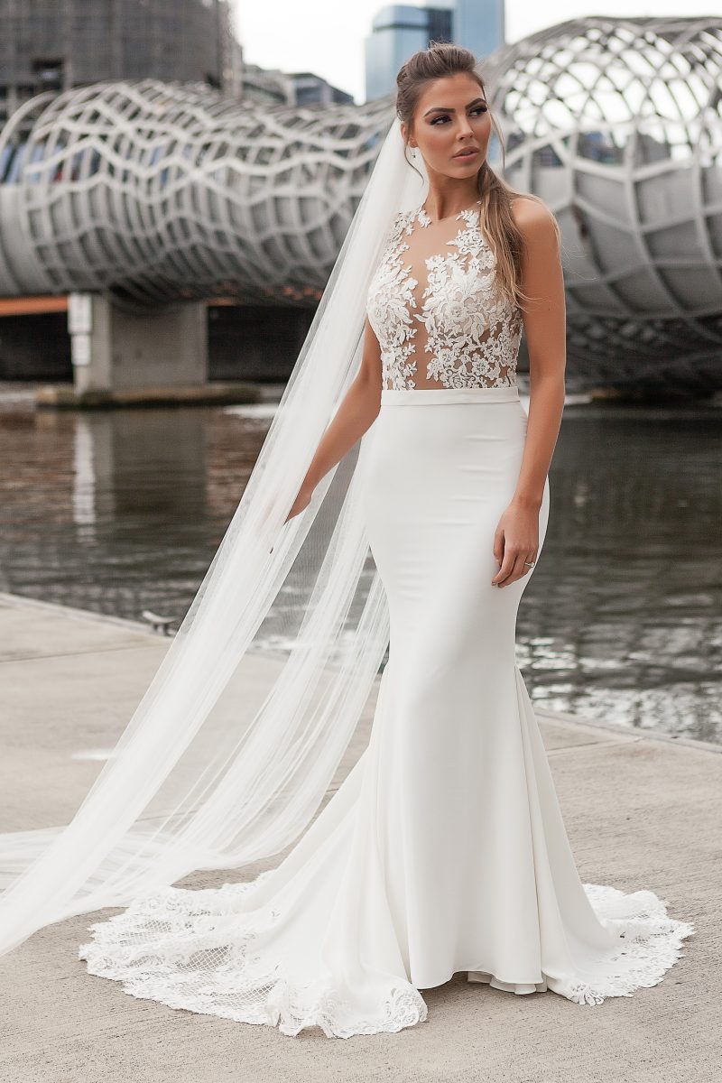 Fitted wedding gowns with lace train in Melbourne